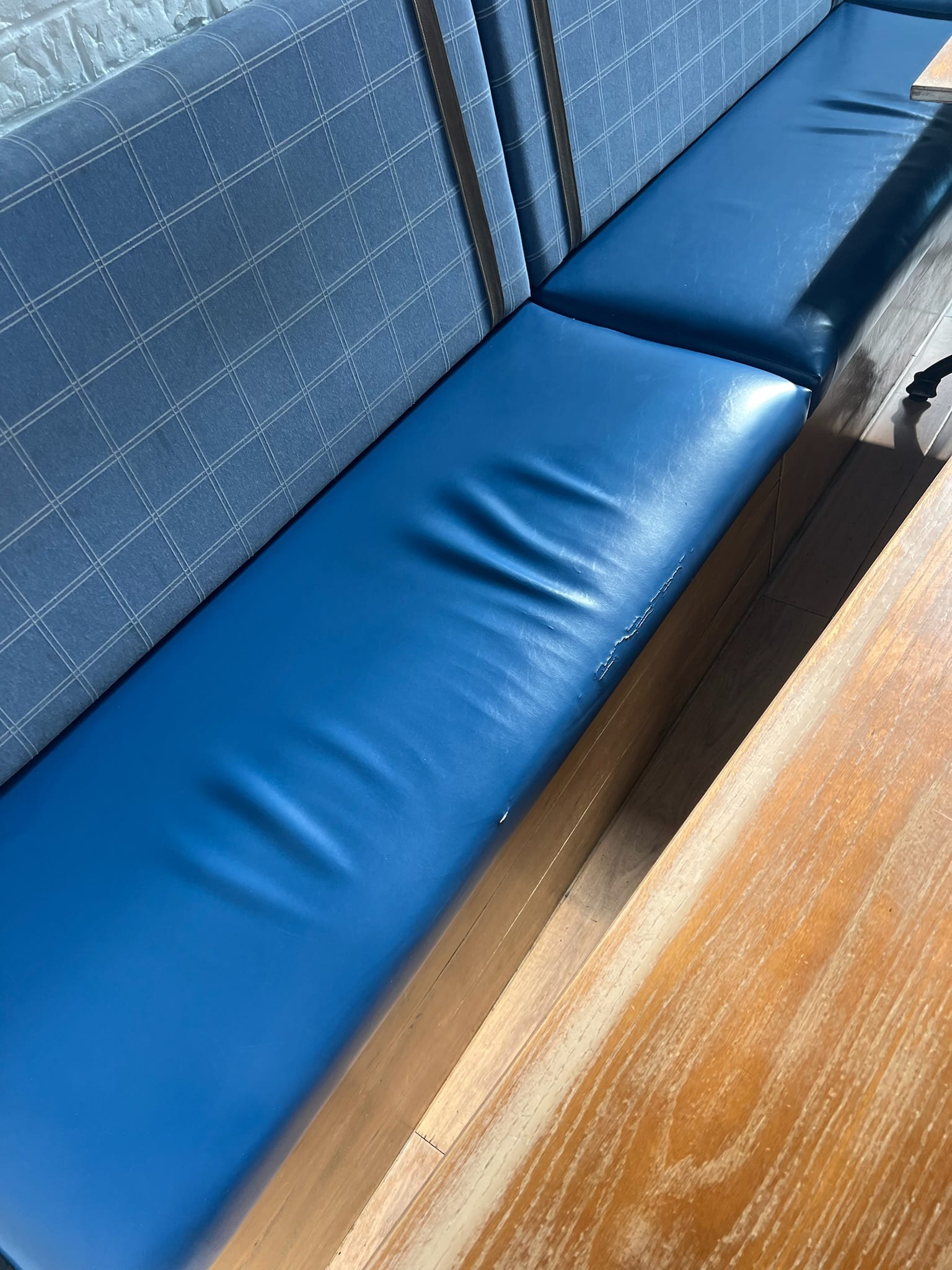 Curved blue restaurant booth detail