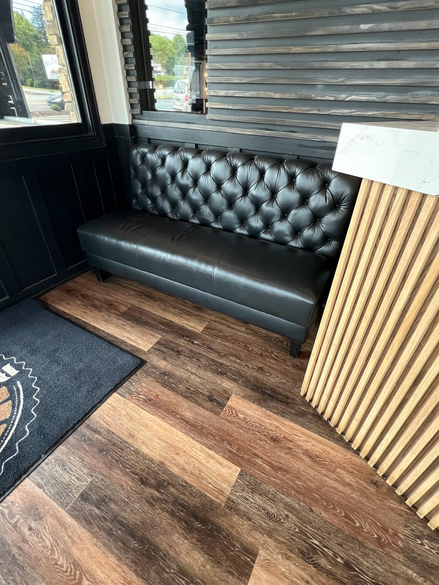Blue channel-stitched restaurant booth