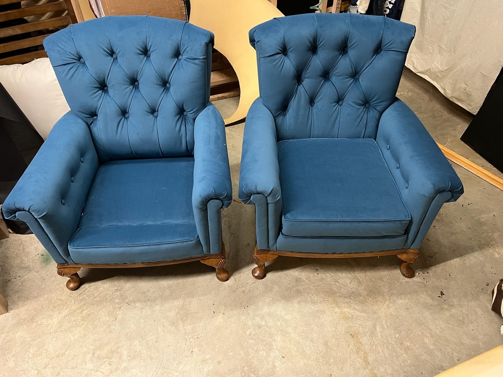 Pair of blue tufted accent chairs reupholstered