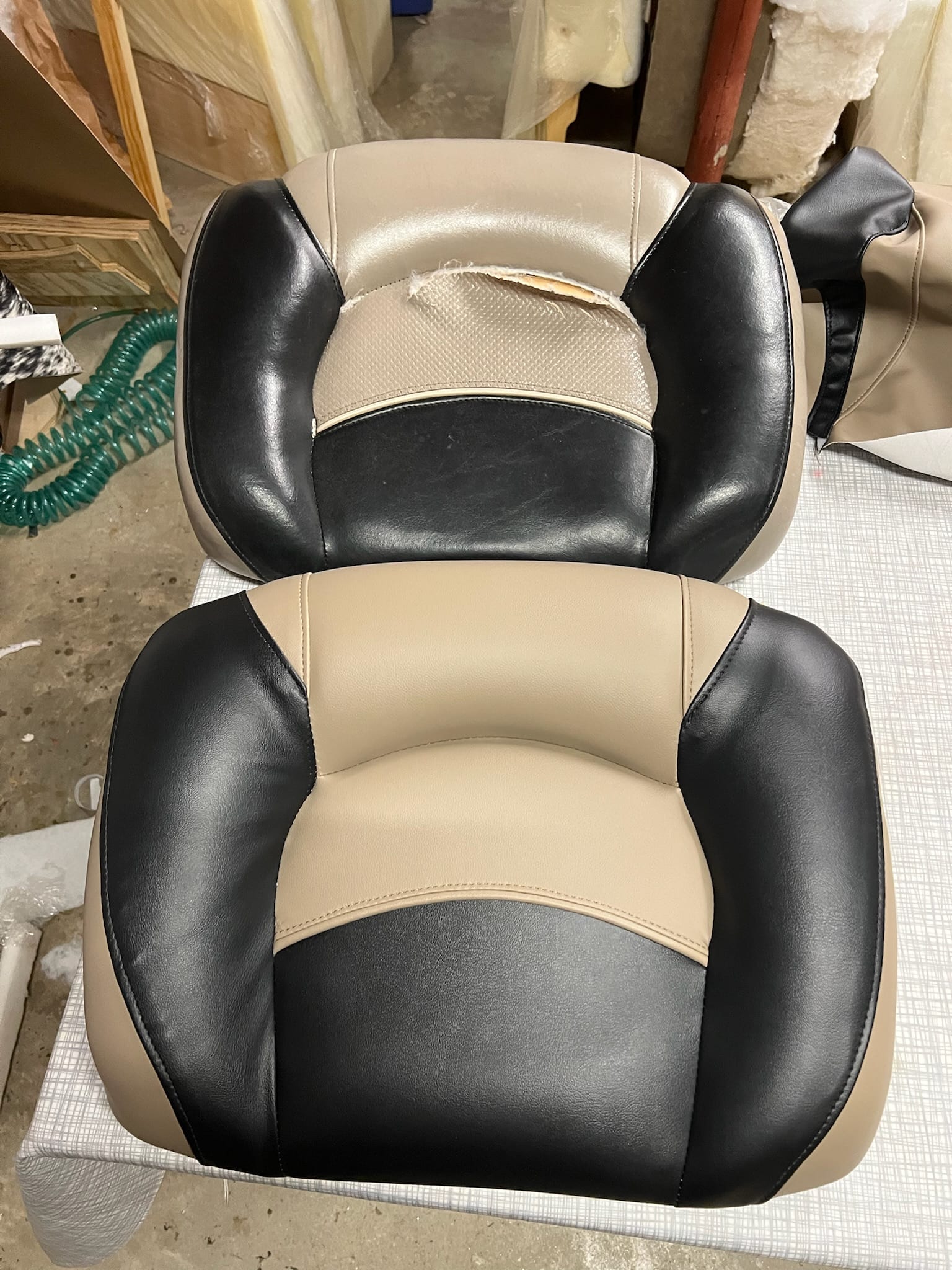 Black and tan boat seat reupholstered in marine-grade UV-stable vinyl