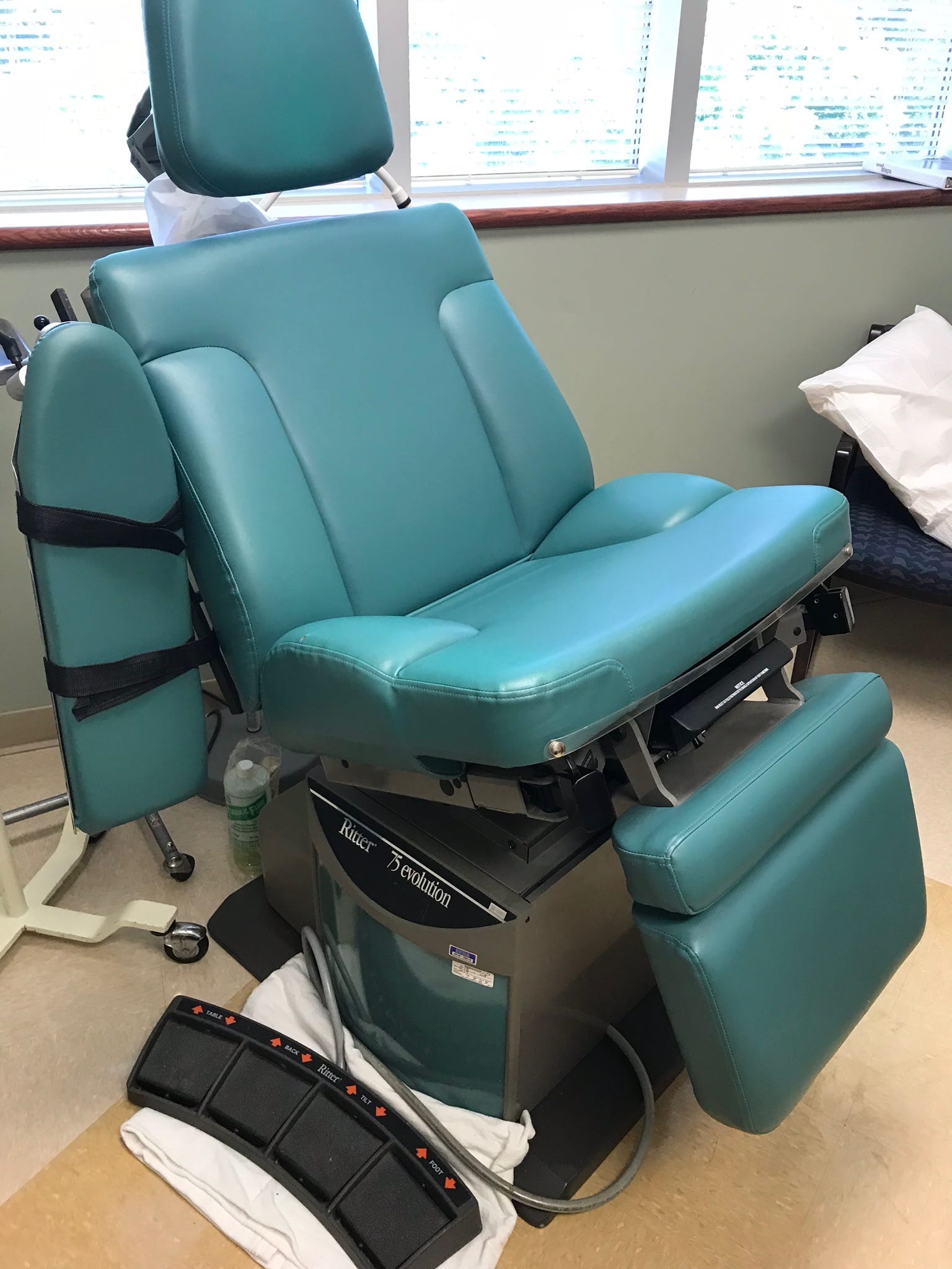 Teal vinyl dental chair reupholstered for practice