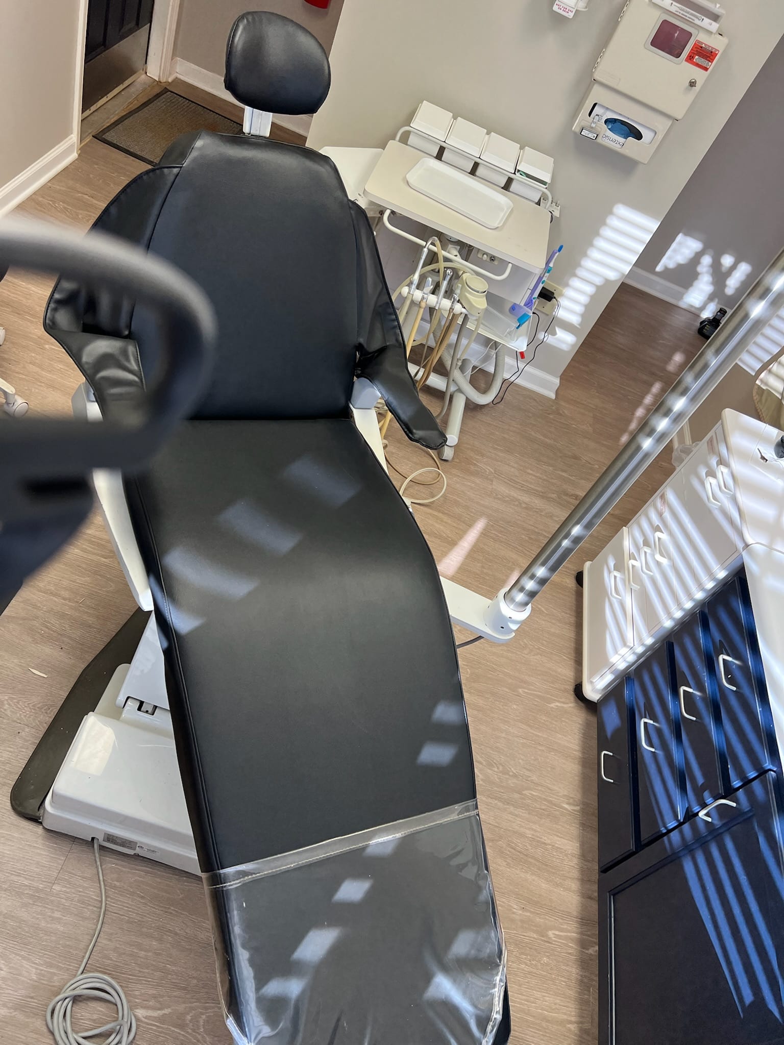 Healthcare exam chair recovered in cleanable medical-grade vinyl