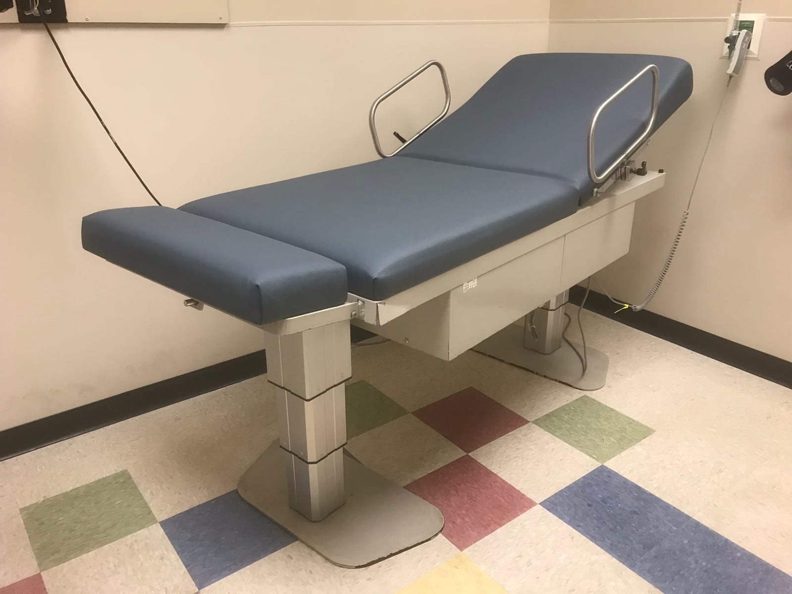 Charcoal vinyl medical exam table reupholstered