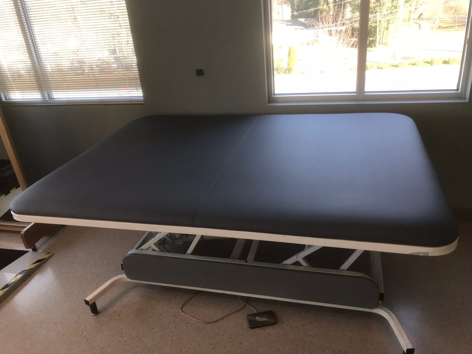 Grey vinyl medical exam table
