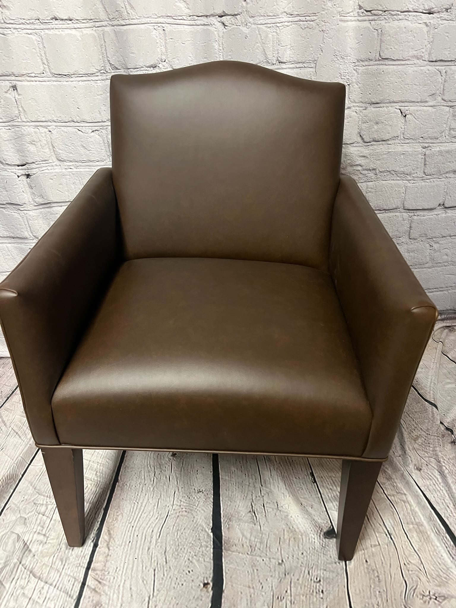 Brown leather arm chair restored to original finish