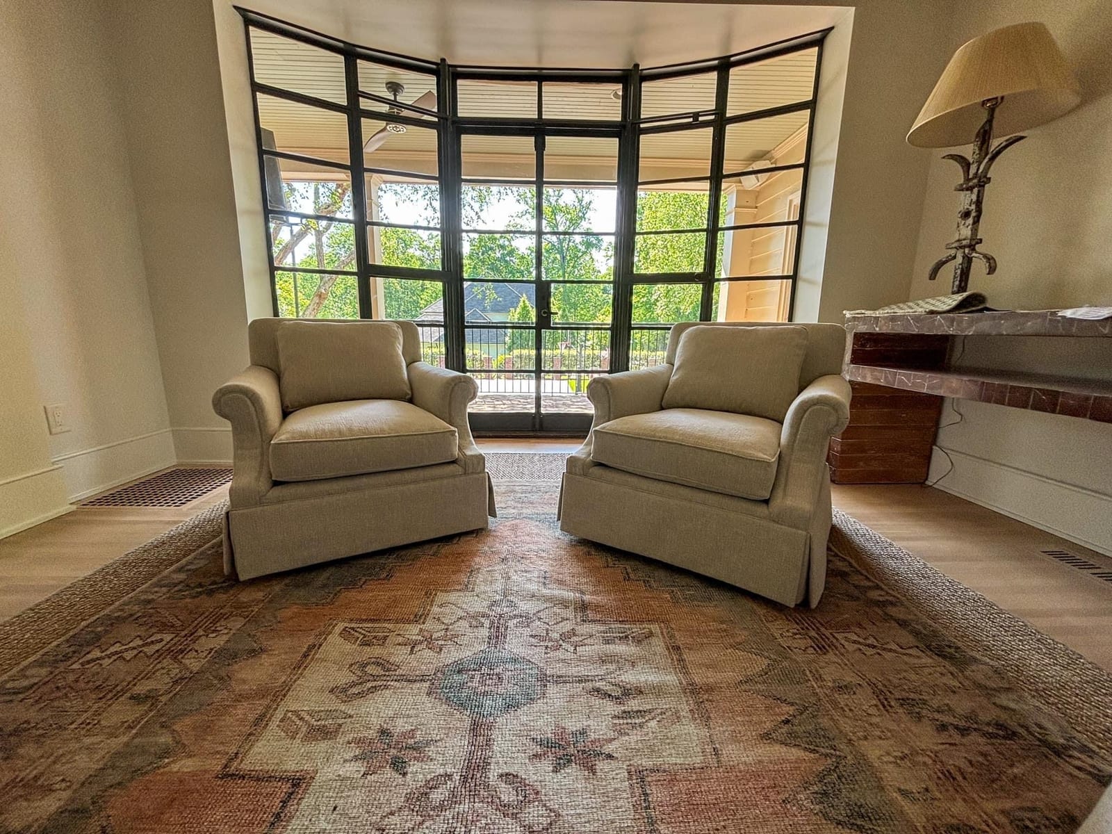 Corner of a residential living room with reupholstered furniture