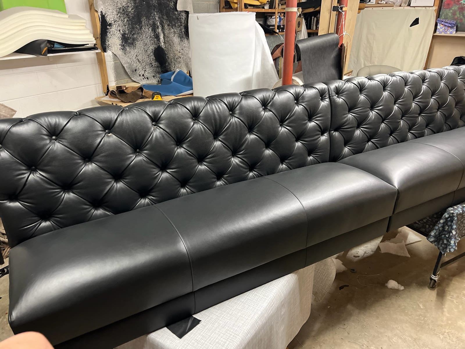 Long black banquette in a commercial dining room