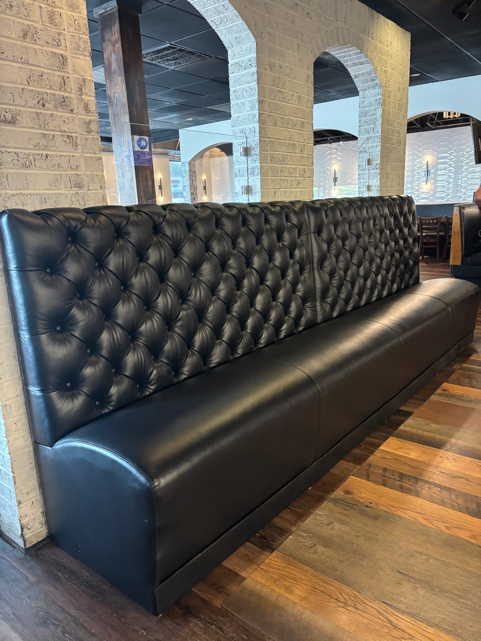 Navy blue banquette reupholstered for restaurant