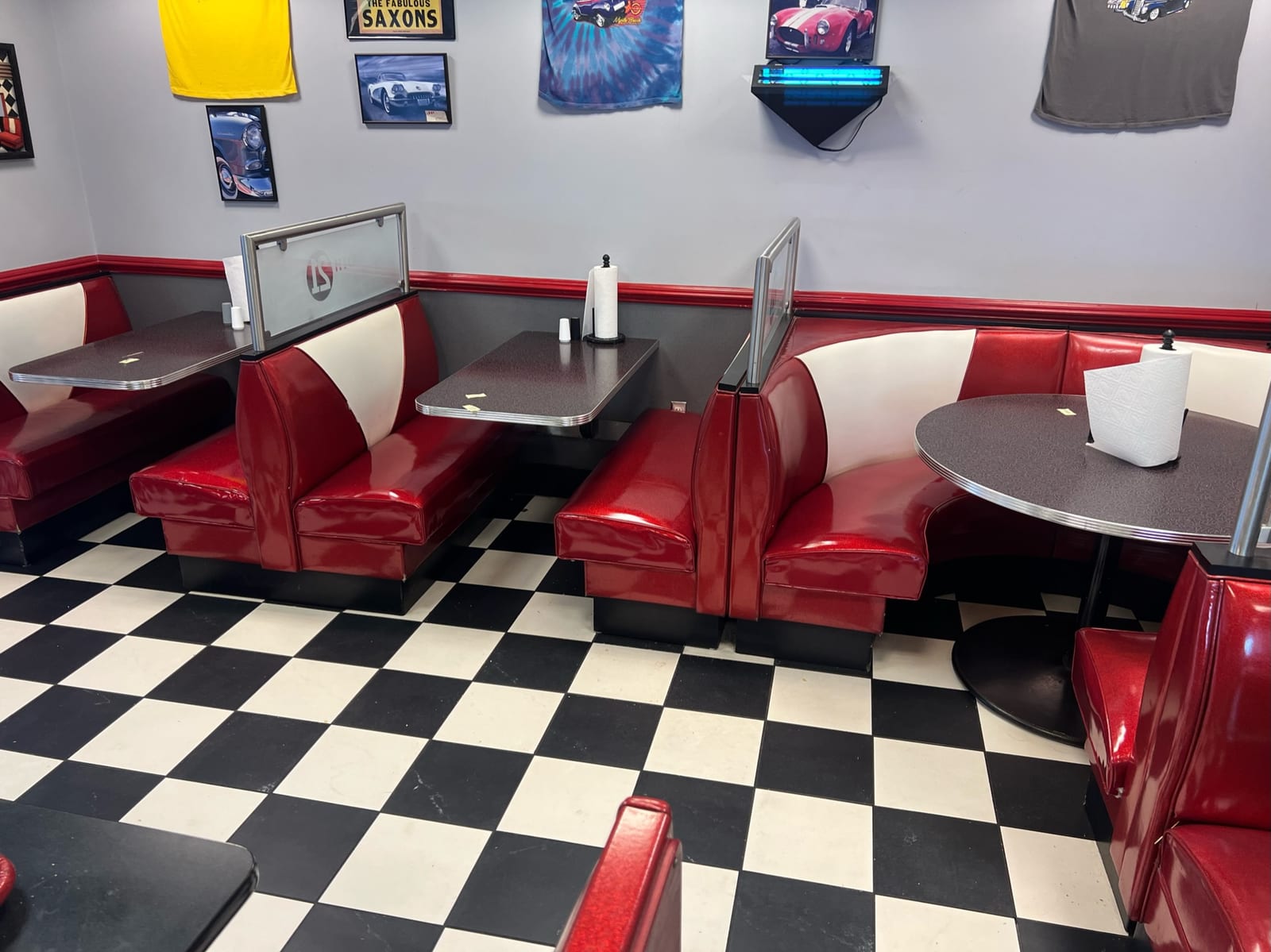 Red and white retro diner booths reupholstered with checkered floor