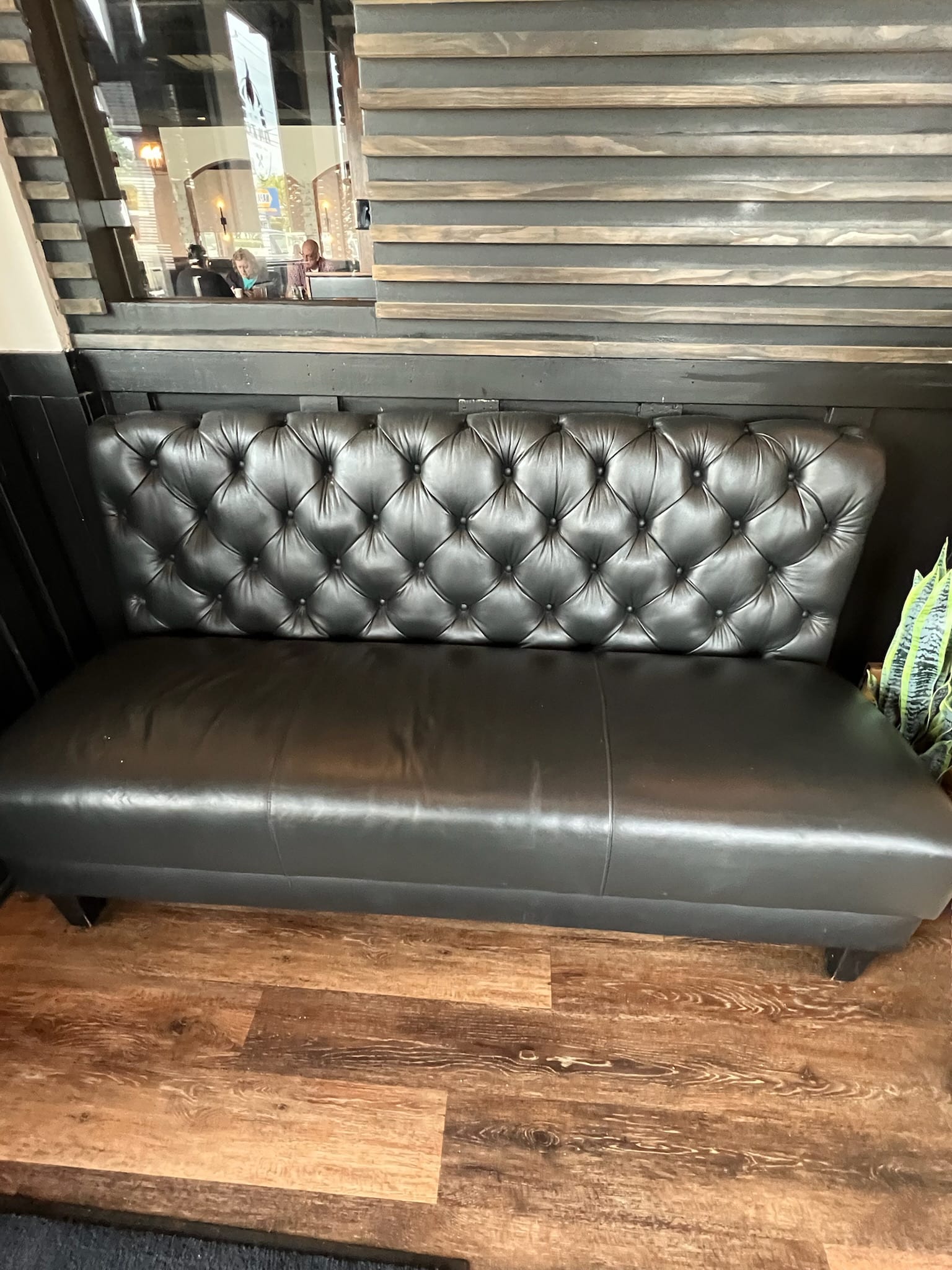 Black diamond-tufted commercial booth in heavy contract vinyl